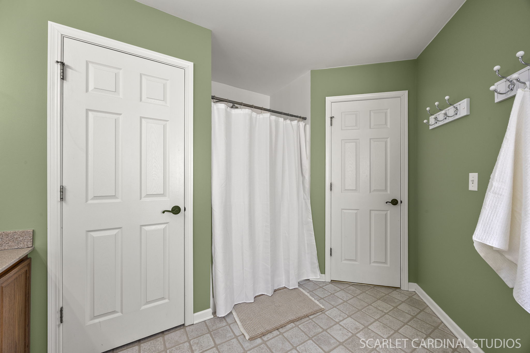 Spacious primary bath with dual-sink vanity, soaking tub & separate shower...