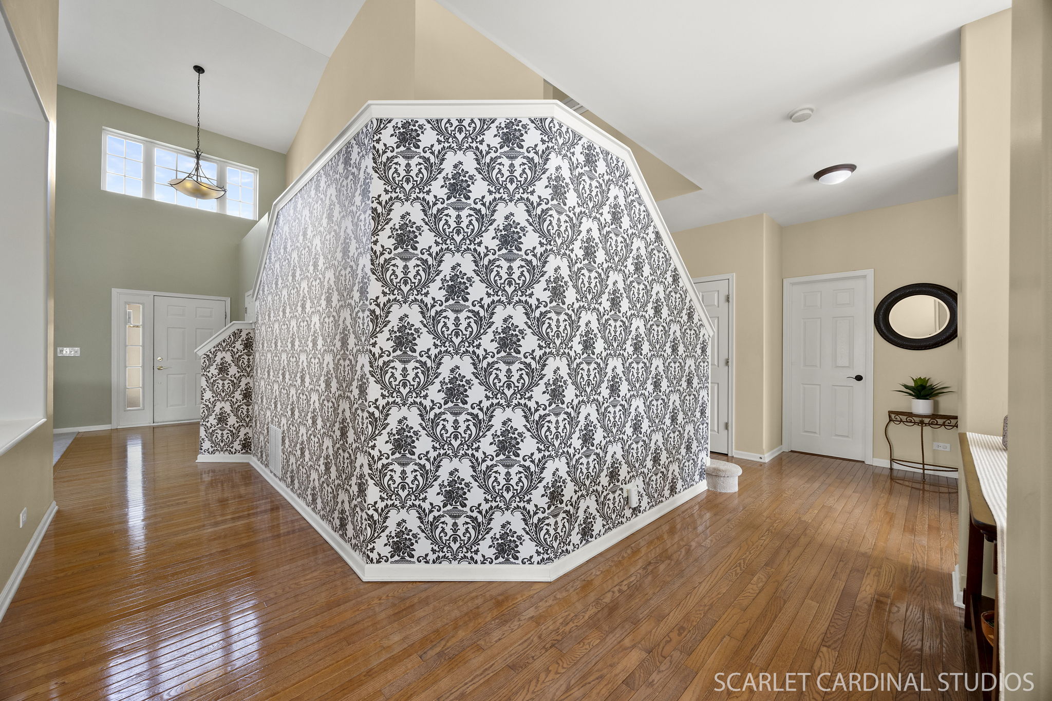 Dramatic dual staircase makes it easy to access 2nd level from living or dining rooms...