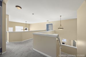 Catwalk with views of 2-story living and family rooms...