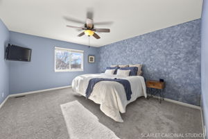 Primary bedroom with custom walk-in closet & private spa-bath