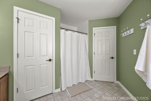 Spacious primary bath with dual-sink vanity, soaking tub & separate shower...