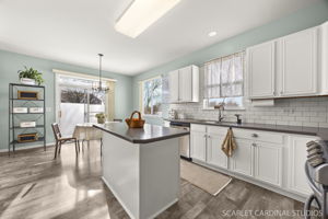 Modern kitchen with center island and casual eating space...