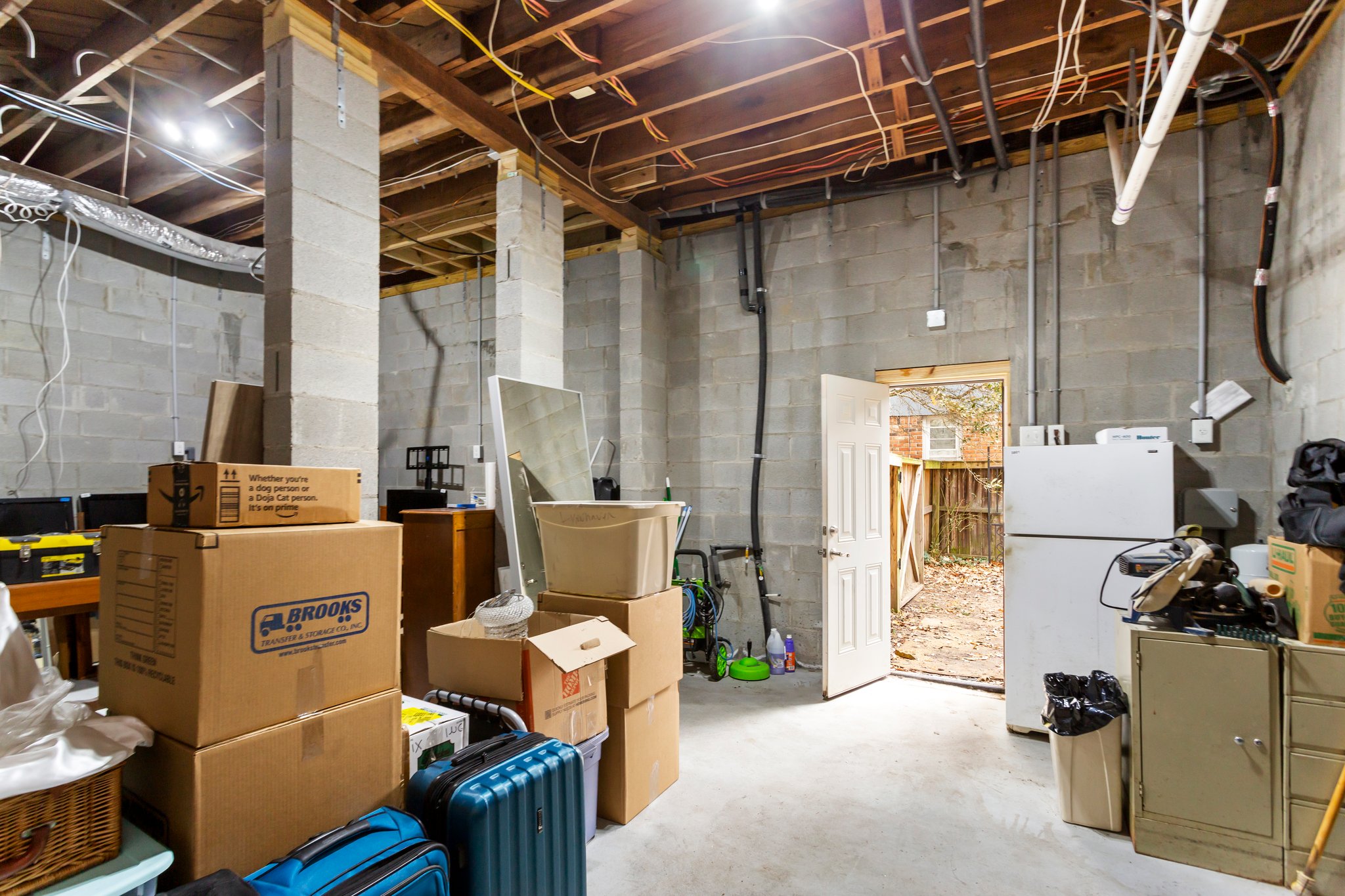 Basement with workshop space and outdoor access