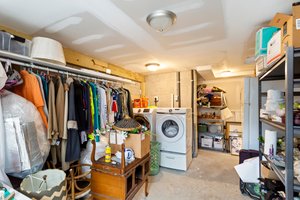 Roomy laundry area designed for convenience and storage