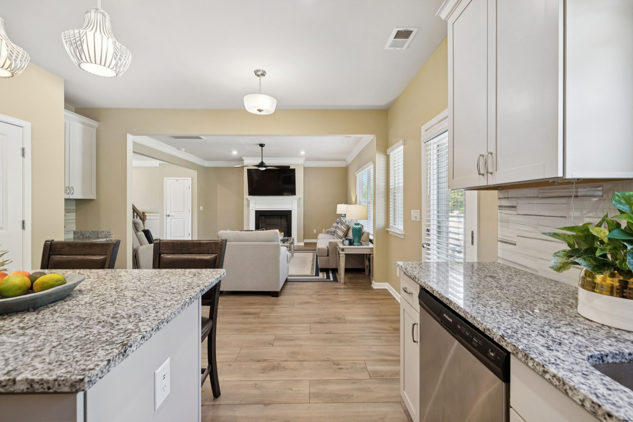 Gather around the island in the heart of the home. All kitchen appliances convey.