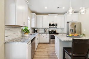 Upgrade: concealed pull-out trash receptacle to right of sink.