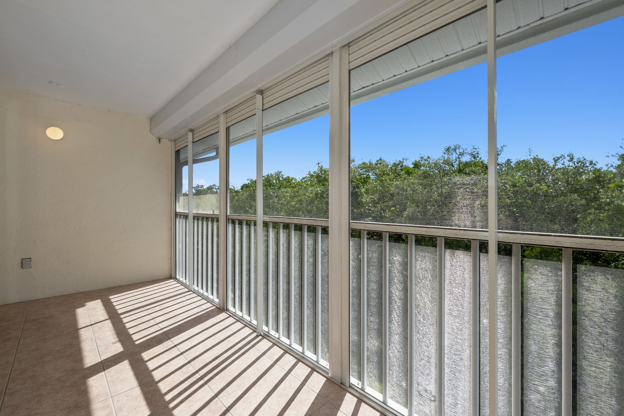 Large Lanai with Bright SW Exposure, Tile Floors, Storm Shutters