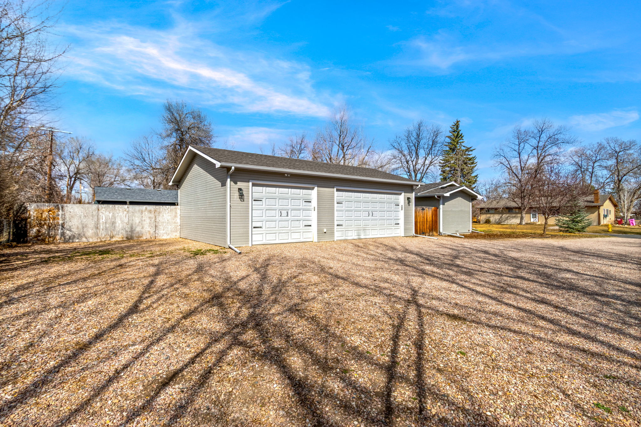 The oversized driveway provides space for multiple vehicles and/or equipment. The corner lot is quiet and gives the feel of not having neighbors too close.