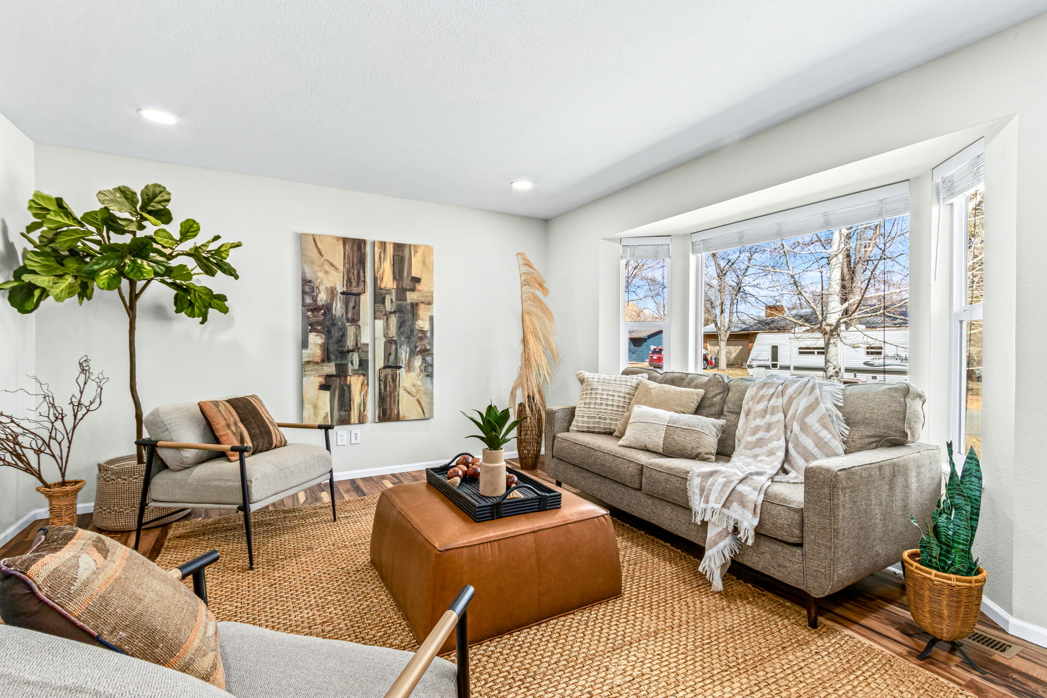 Light and bright room with a sunny bay window and recessed lighting.
