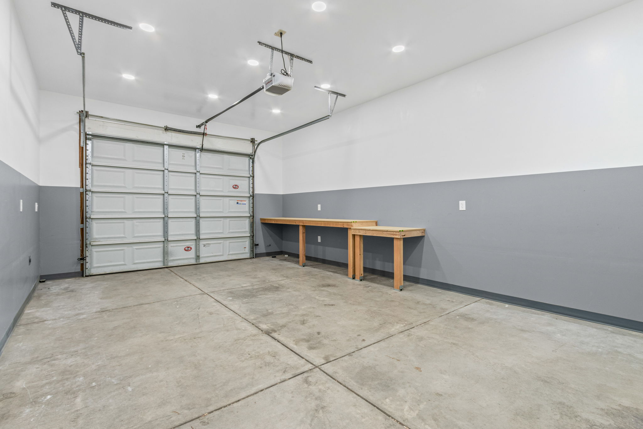 Single stall bay - separated by a door makes for a great shop space as well as for vehicles. Fully drywalled, great lighting, and plenty of electrical outlets.