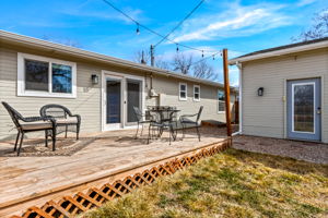 Large back deck within the fully fenced backyard. Access to the detached garage/shop through the backyard.