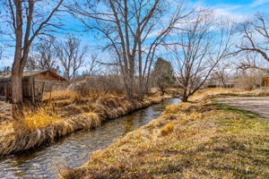 The Little Cache la Poudre ditch running by the property provides a sense of waterfront property and tranquility (water runs seasonally)