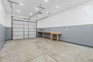 Single stall bay - separated by a door makes for a great shop space as well as for vehicles. Fully drywalled, great lighting, and plenty of electrical outlets.