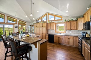 14 x 14 Kitchen / Vaulted Ceilings / Wood Floors / Ample bar Seating