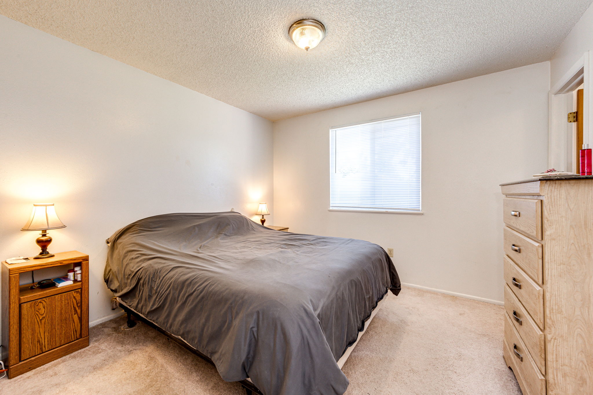 Main floor Bedroom 1 with a walk-in closet
