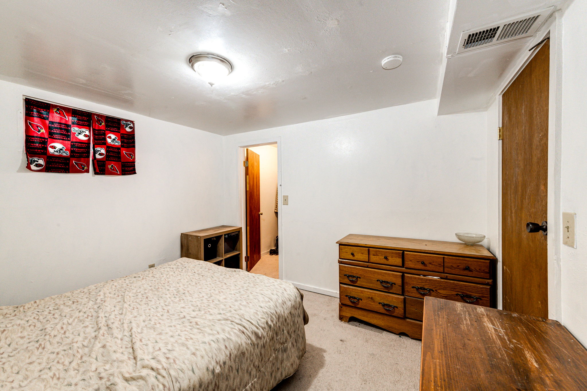 Basement Bedroom 4 with a walk-in closet