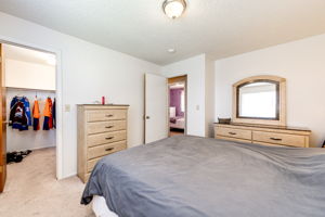 Main floor Bedroom 1 with a walk-in closet