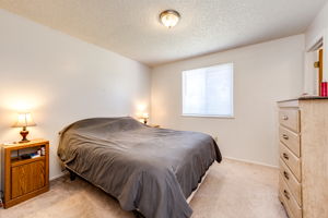 Main floor Bedroom 1 with a walk-in closet