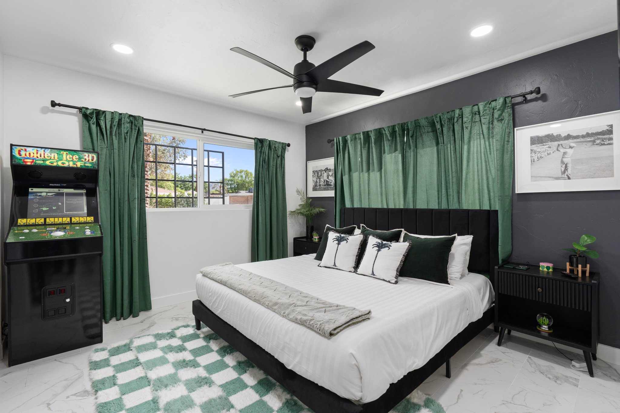 Second Bedroom. The golf room. King bed in rich green with black and white accents.