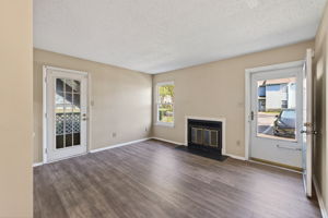 Open living room with fireplace focal point.