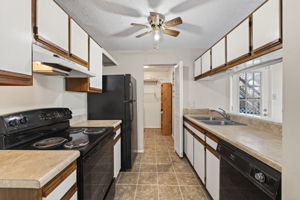 Efficient kitchen with oversized utility room.