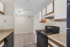 Kitchen flows to dining and living room.
