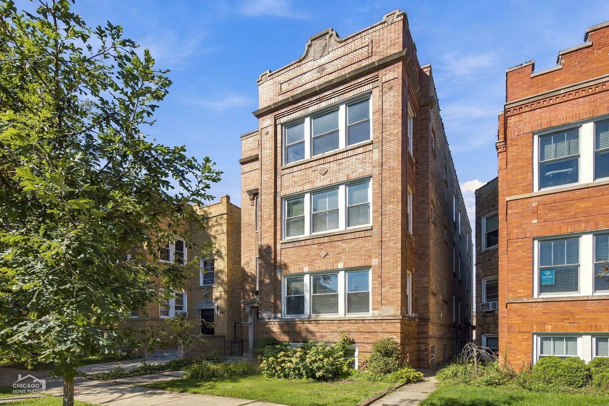 Classic Chicago brick three flat. Short 15 minute walk to Blue Line, 1 minute to CTA bus line