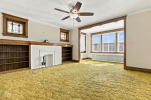 Second floor living room, vintage stain glass windows