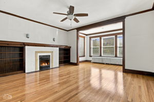 First floor living room, decorative fireplace and built-ins