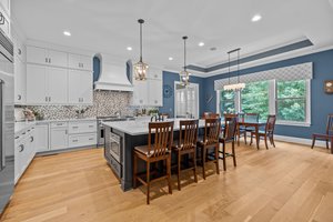 Ceiling High Cabinets & Large Island with Seating Space