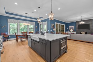 Farmhouse Sink, Pendulum Lighting, Quartz Countertops