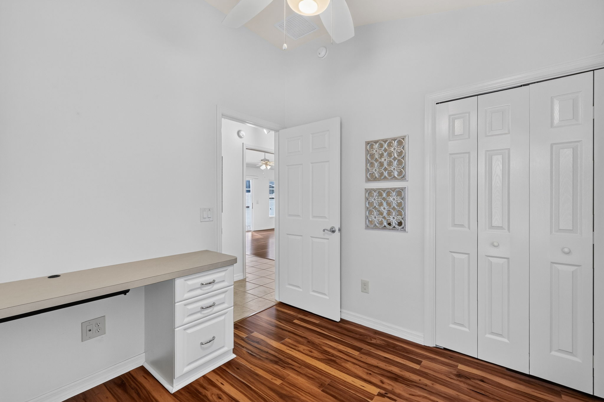Second Bedroom with Murphy Bed, Custom Cabinetry, and Built-In Desk