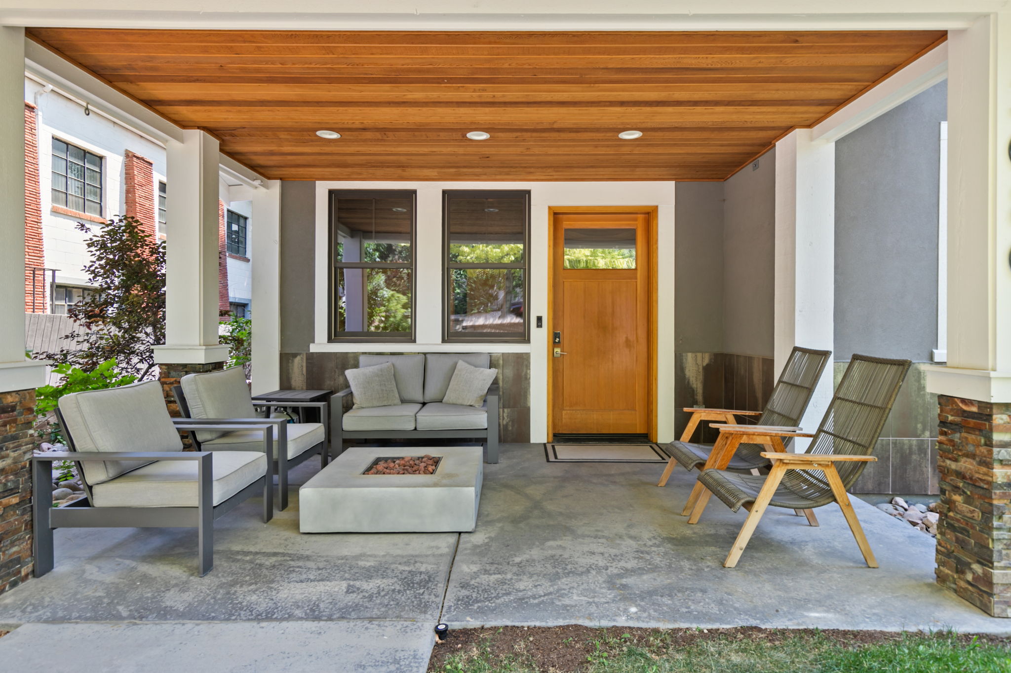 Welcoming covered front entry/ patio