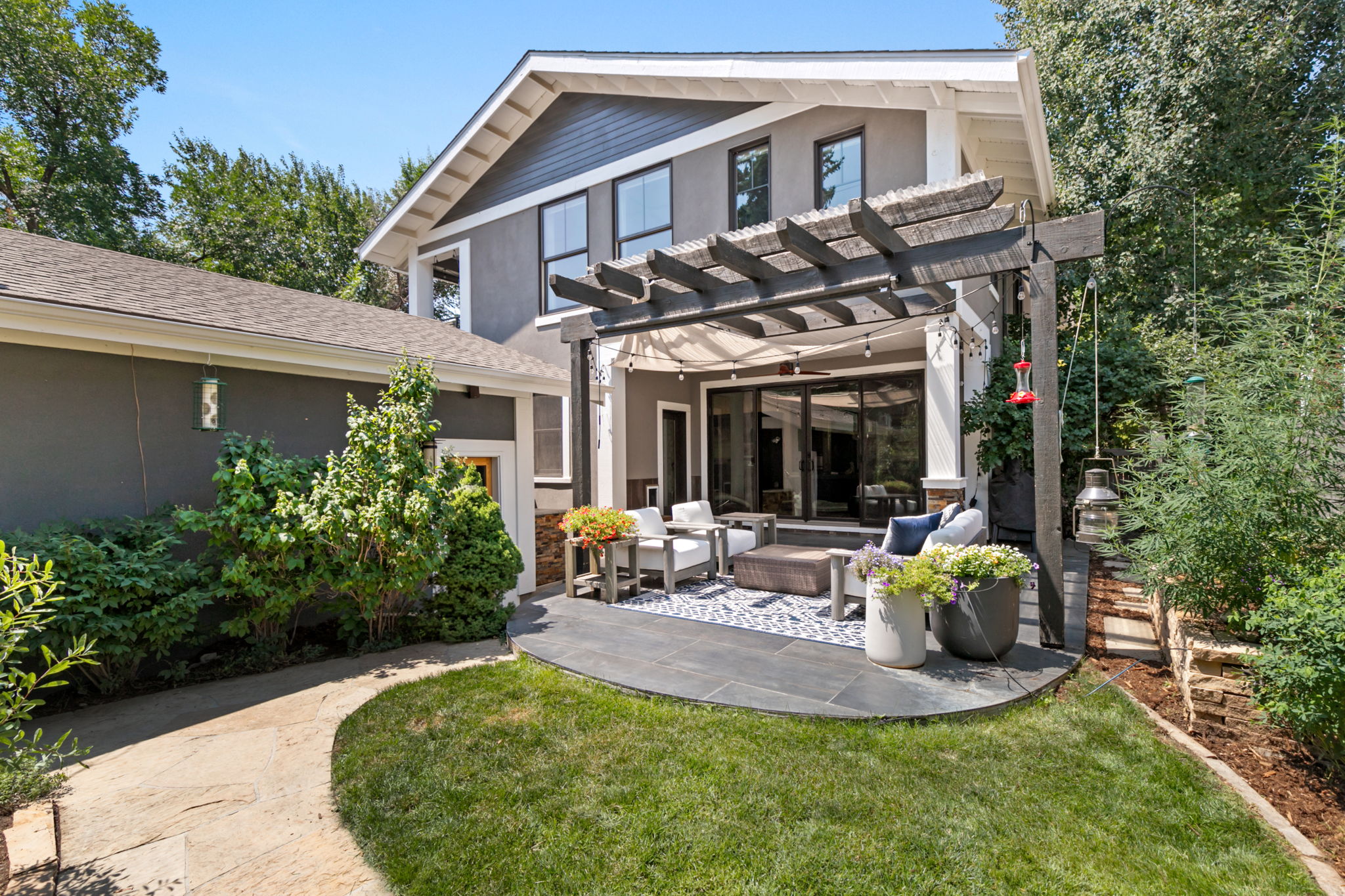 Tranquil back yard leading to alley and 2 car garage