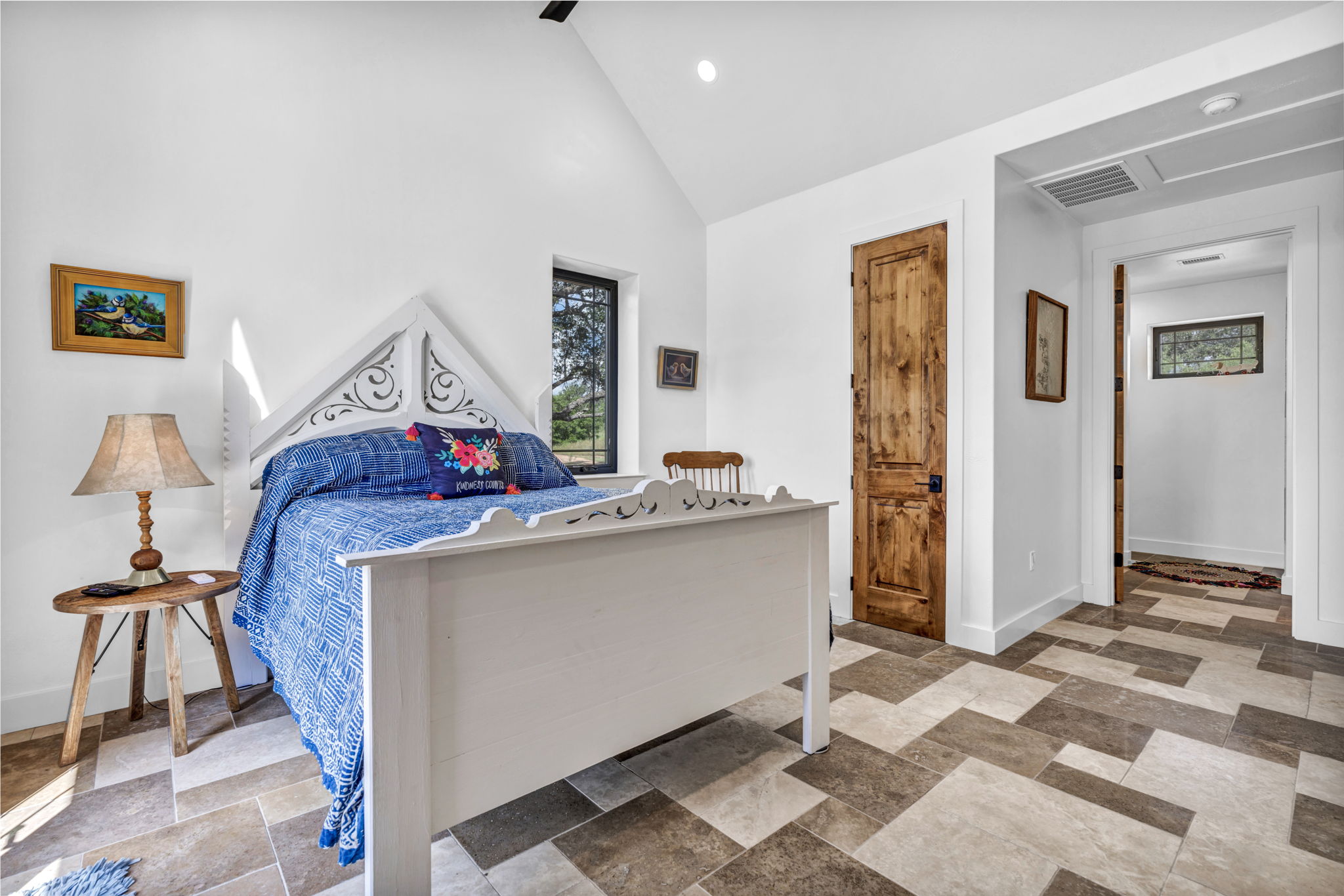 View in main bedroom reflects the door to the walk-in closet and full bath