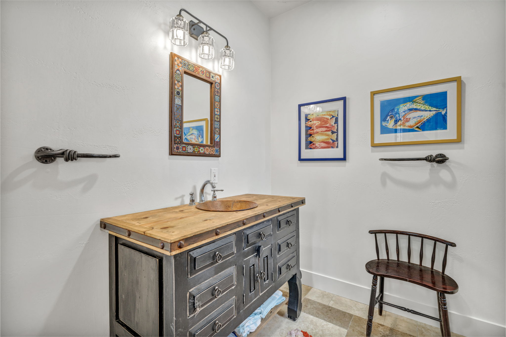 Secondary bathroom with antique custom vanity, copper sink, walk-in shower