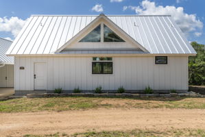 back of the home faces the road, mechanical closet thru the door to the left, kitchen window allows view to the road