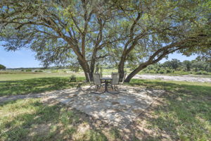 Patio , fire pit, & picnic area down near the river plus a fire-it!