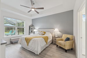 Spacious Primary Bedroom Overlooks Pool with Tray Ceilings