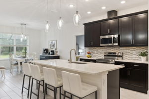 Oversized Quartz Island with single deep sink and custom lighting