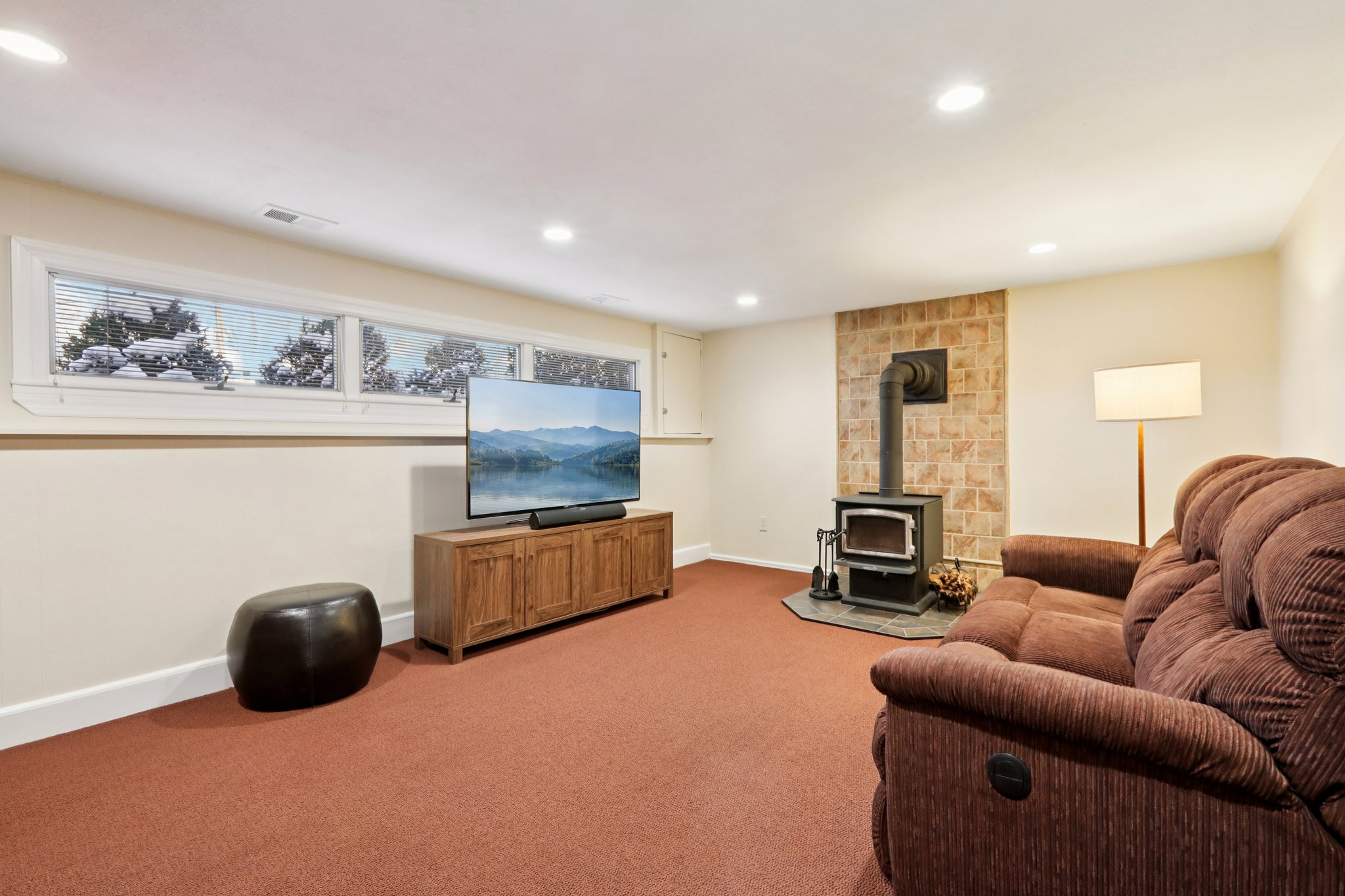 Comfy wood burning stove greets you in your Family Room with recessed lighting & windows overlooking the front yard.