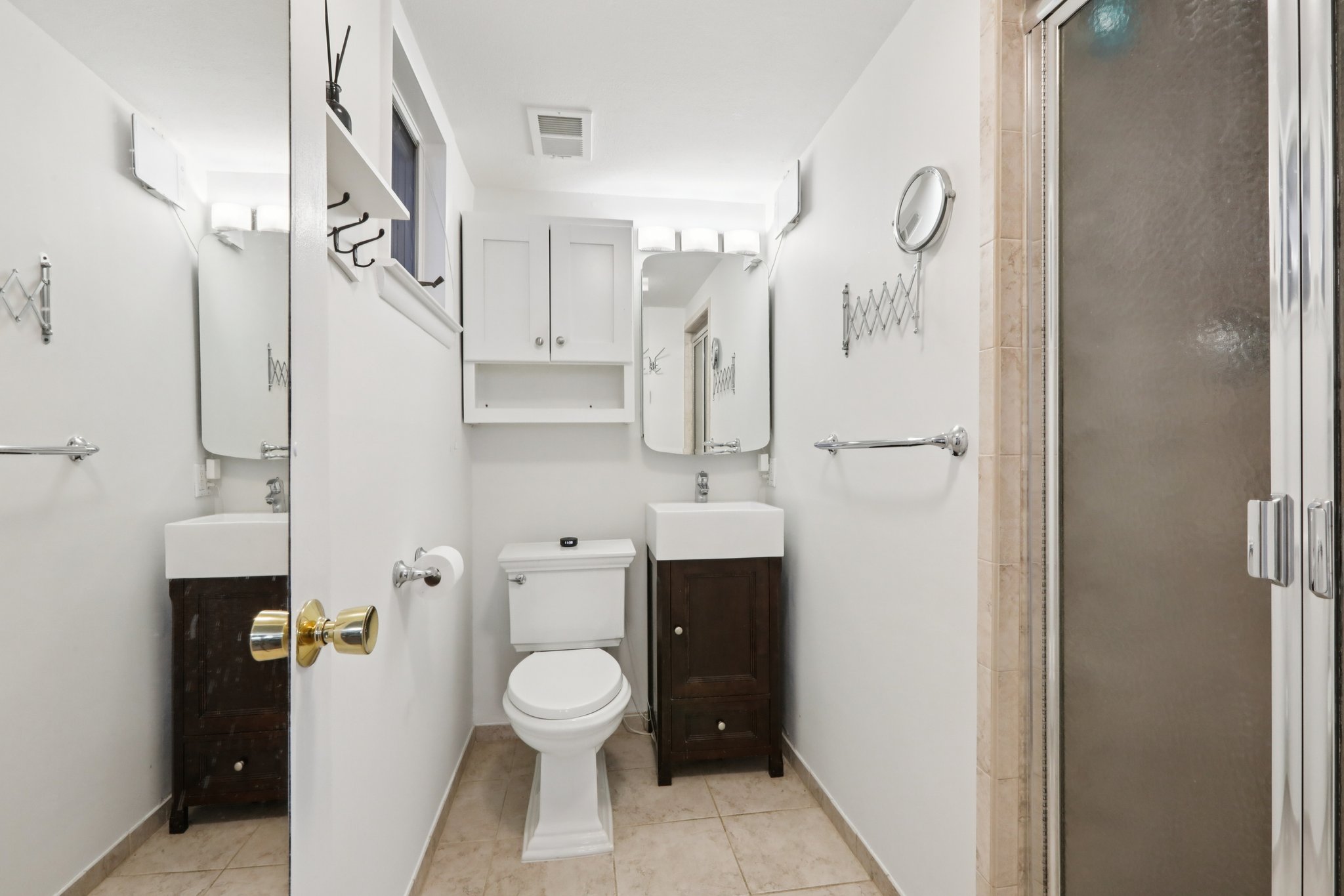 Third full bath in lower level has a shower, with window, new vanity and sink, commode and freshly painted.