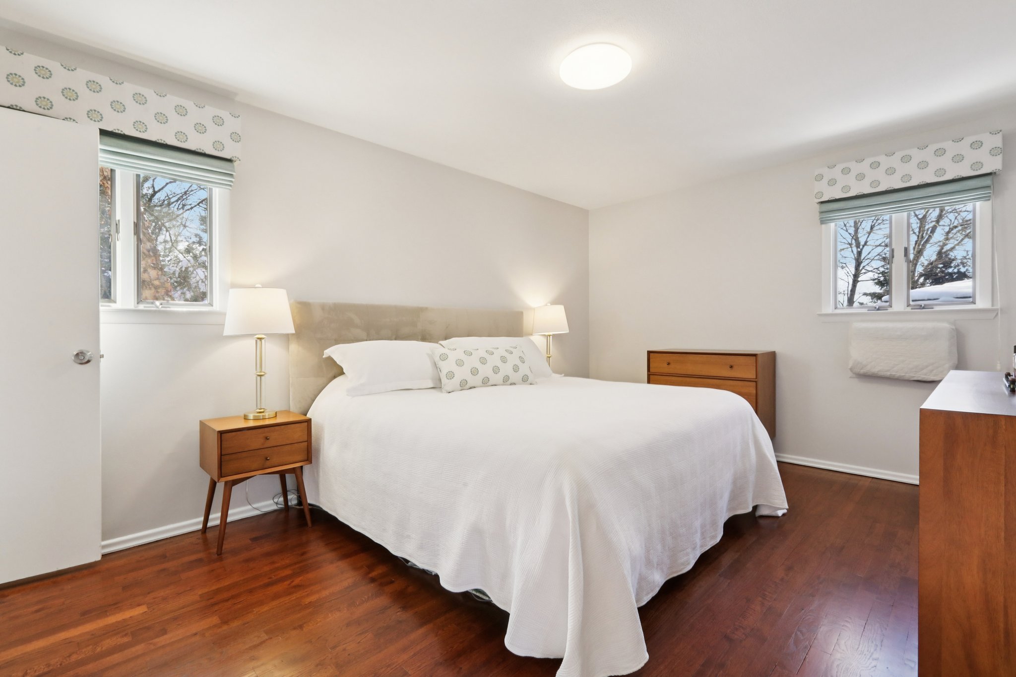 Wood floors recently finished, double exposure windows, in wall A/C, walk-in closet, newly renovated ensuite bath.