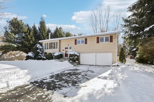 Even in the snow this home has inviting appeal with a flat driveway at the end of the cul-de-sac.