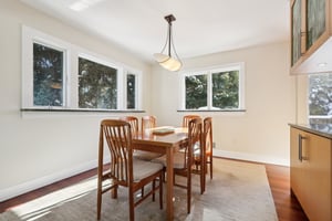 A verdant setting in this picture for the Dining Area with private views to the side and rear yards.