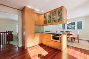 Full pantry, microwave tucked away under granite counter! Above art glass cabinet with under mounted lighting.