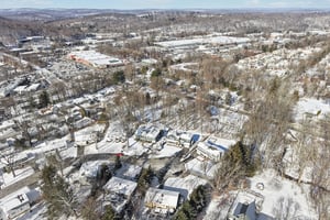 Another aerial view of the street showing the home at the end of the cul-de-sac.