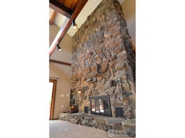 Soaring 20 Ft Stone Fireplace with Rock from Property
