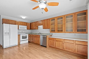 Lots of storage in beautiful wood cabinets