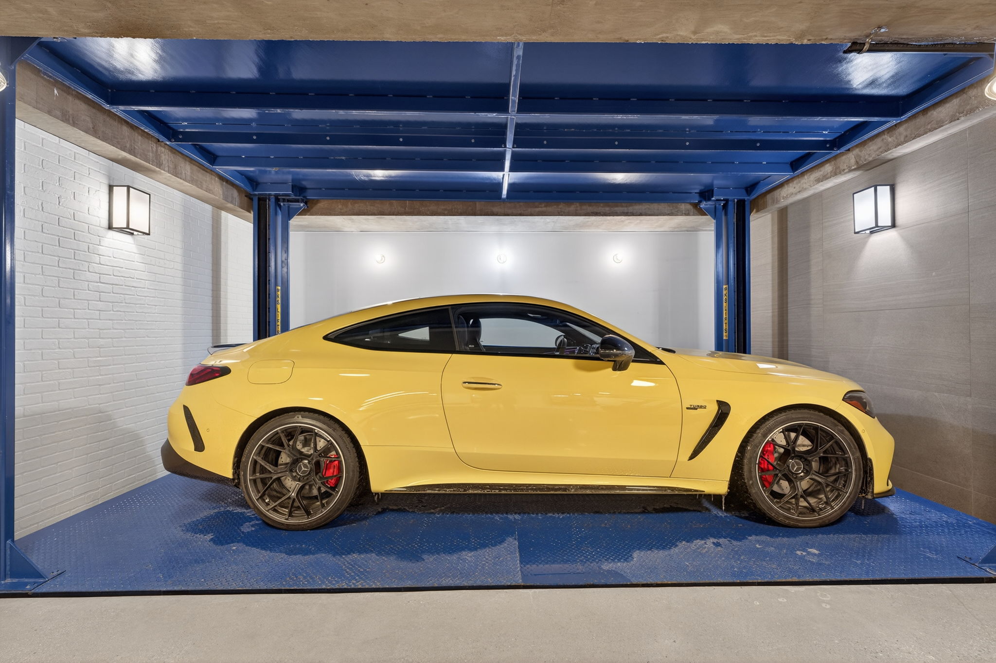 Showcase garage with a rare built-in car lift